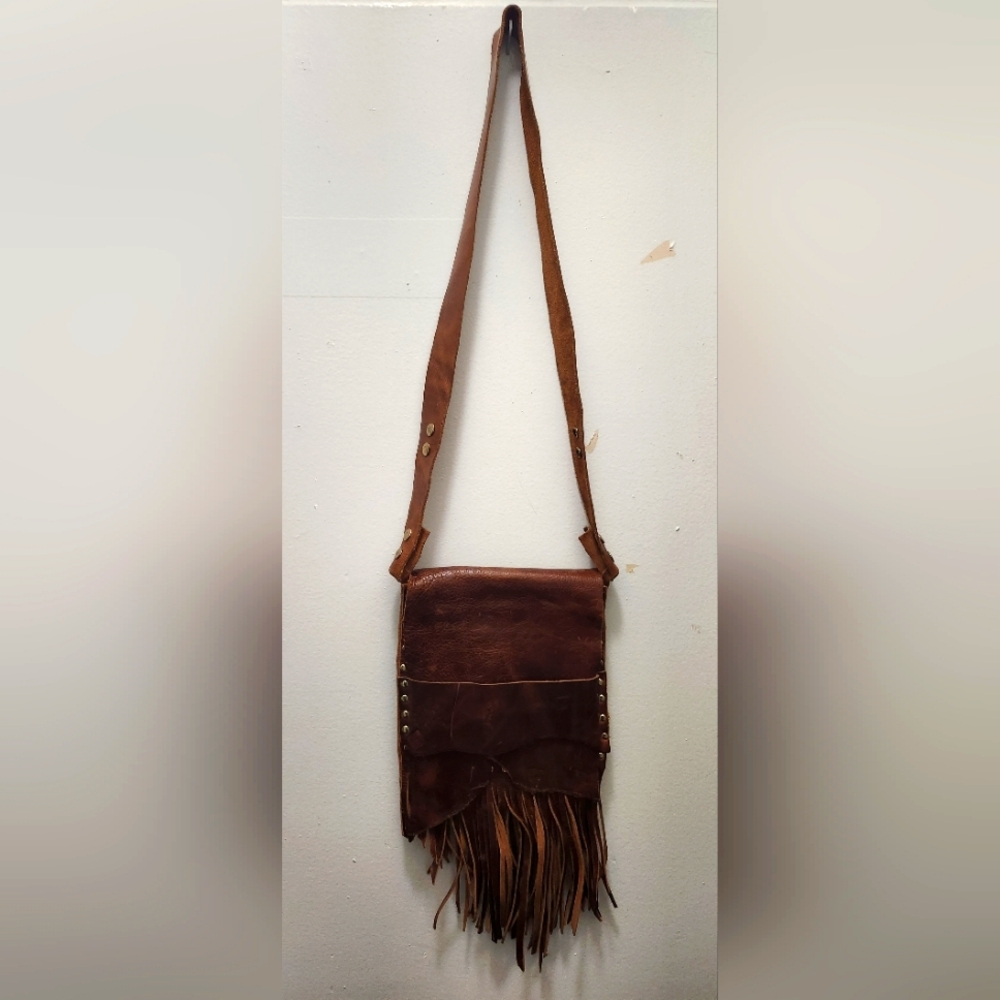 Handmade leather fringe purse with gold studs